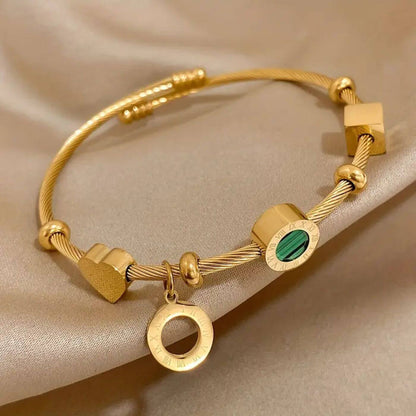 Emerald Accent Gold Charm Bracelet